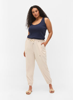 Bukser med lommer og elastikkant , Warm Sand, Model image number 0