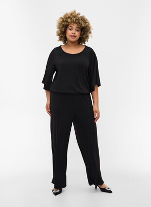 Kortærmet jumpsuit med glimmer, Black, Model image number 0