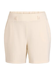 Shorts med lommer og l&oslash;s pasform, Beige