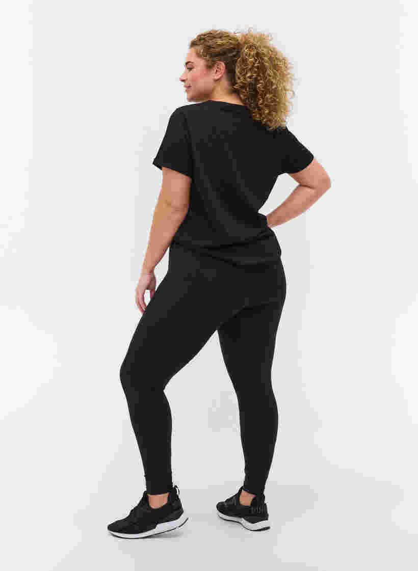 Cropped træningstights med lomme og reflex, Black, Model image number 1