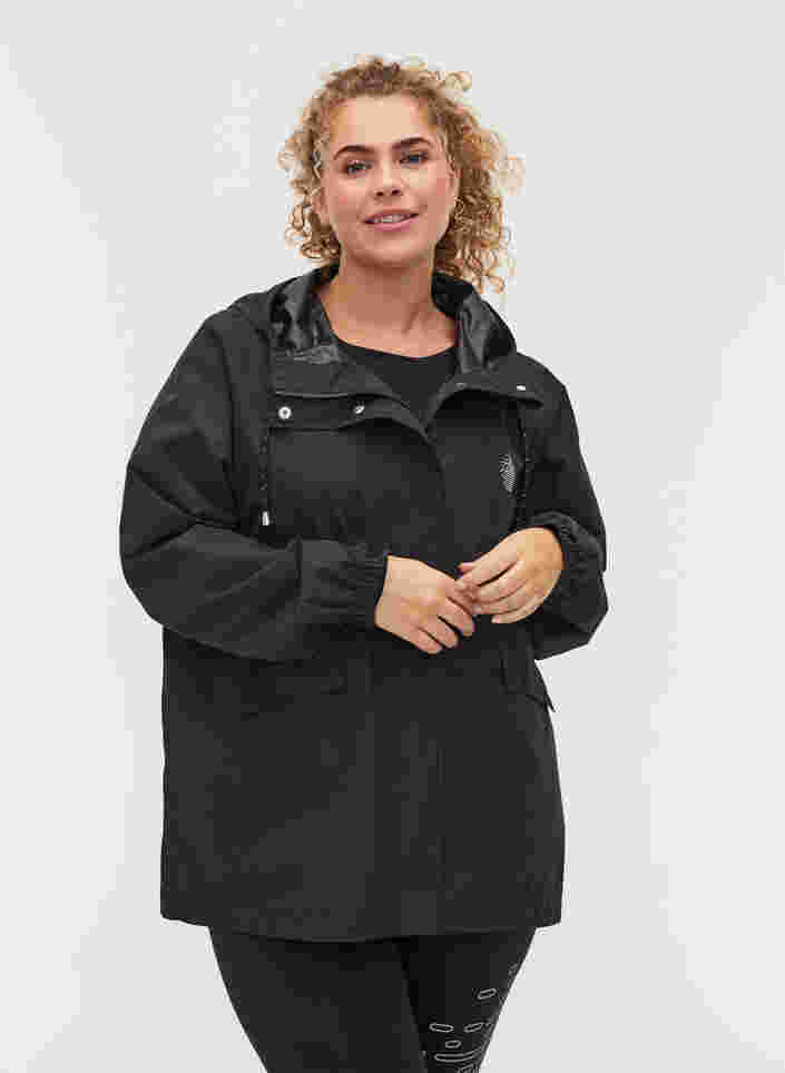 Sports regnjakke med hætte og lommer, Black, Model image number 0