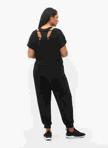 Træningsbukser med lommer, Black, Model image number 1