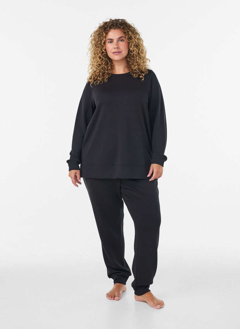 Lang&aelig;rmet jerseybluse med rund hals, Sort, Model image number 1