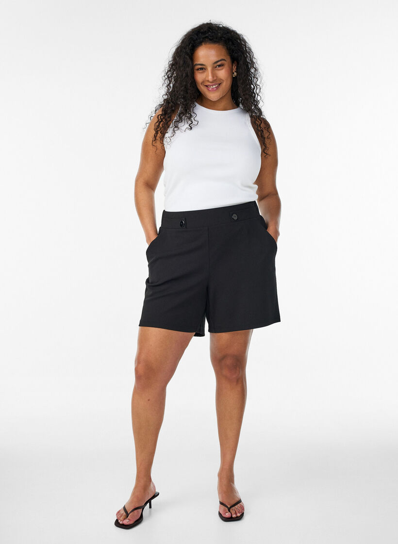 Shorts med lommer og l&oslash;s pasform, Sort, Model image number 1
