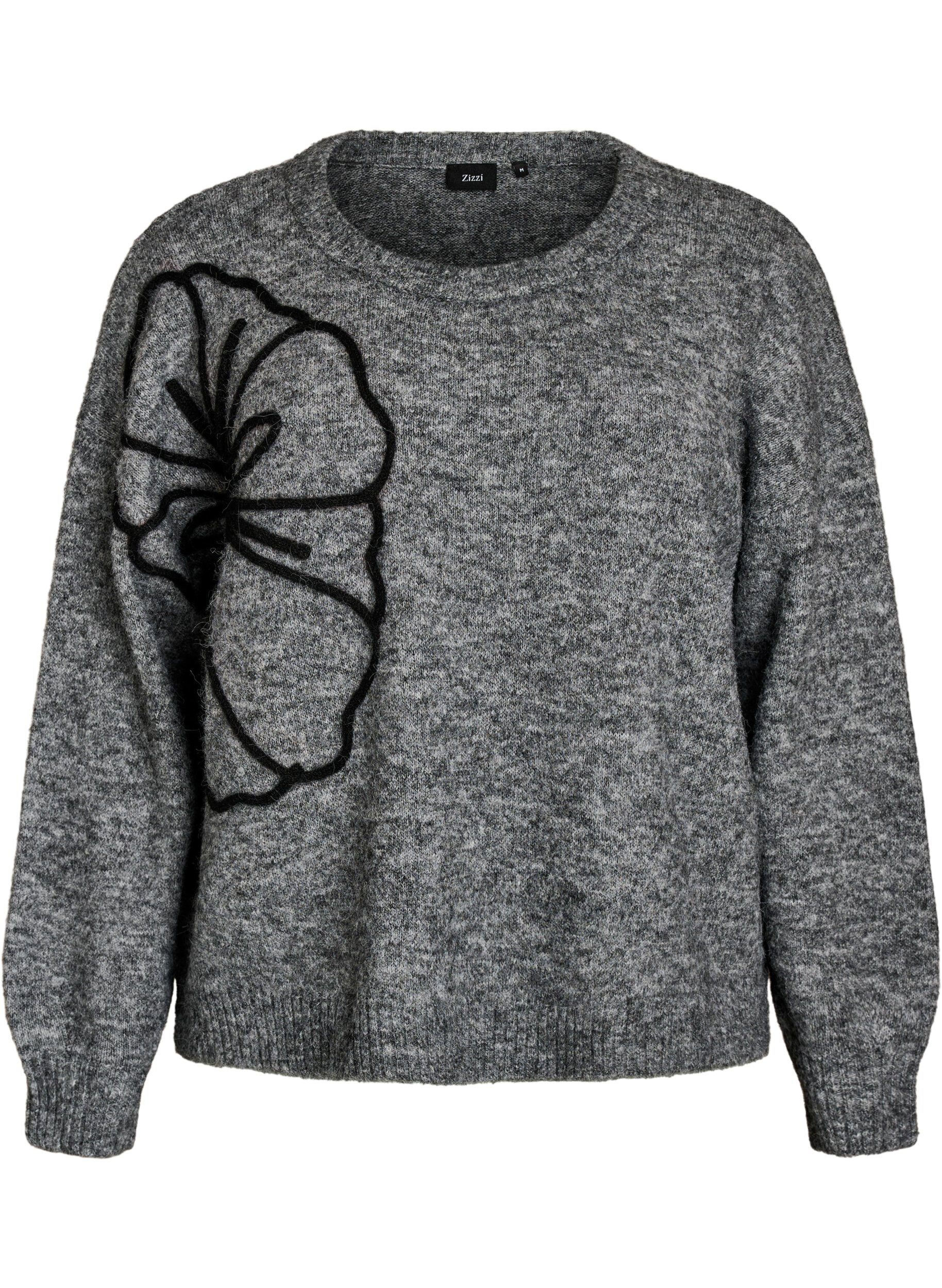 Strikbluse med blomsterapplikation