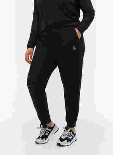 Ensfarvede træningsbukser med lommer, Black, Model image number 2
