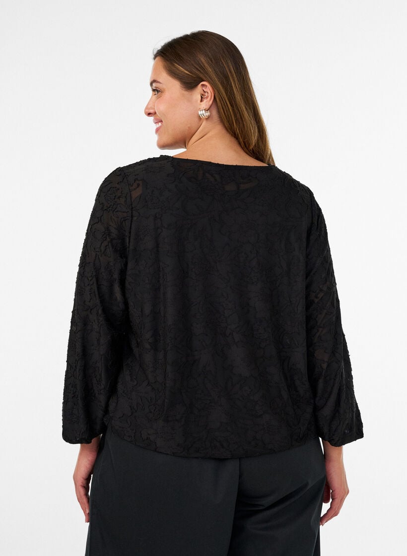 Transparent bluse med blomsterstruktur og lange &aelig;rmer, Sort, Model image number 2