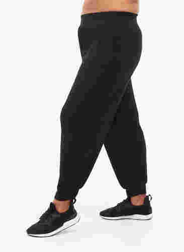 Træningsbukser med lommer, Black, Model image number 0