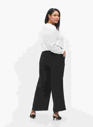 Flared bukser med lommer, Black, Model image number 1