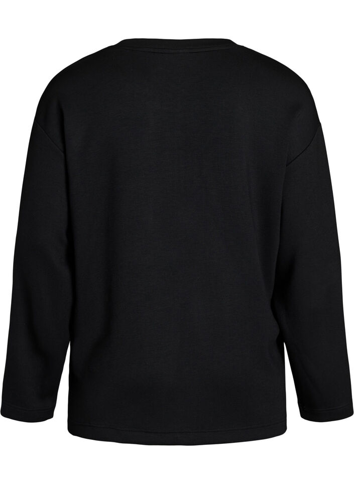 Jerseybluse med diagonal fl&aelig;sedetalje, Sort, Packshot image number 1