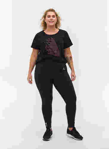 Cropped træningstights med lomme og reflex, Black, Model image number 0
