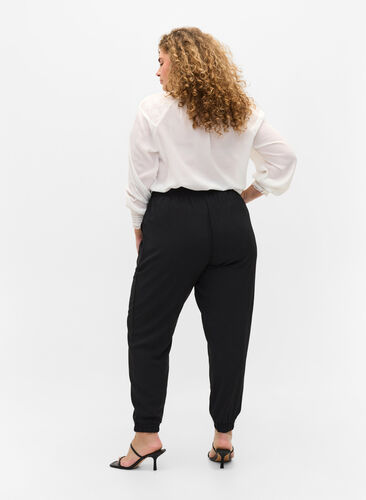Bukser med lommer og elastikkant , Black, Model image number 1