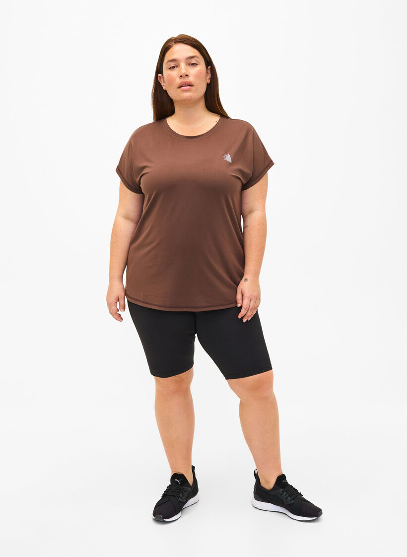 Tætsiddende træningsshorts med lommer, Sort, Model image number 1