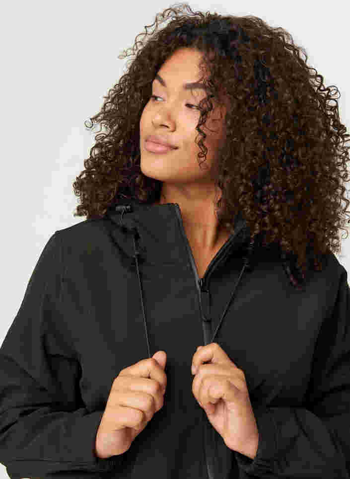 Kort softshell jakke med hætte, Black, Model image number 4