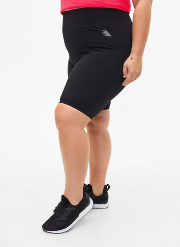Tætsiddende træningsshorts med lomme, Black, Model image number 0