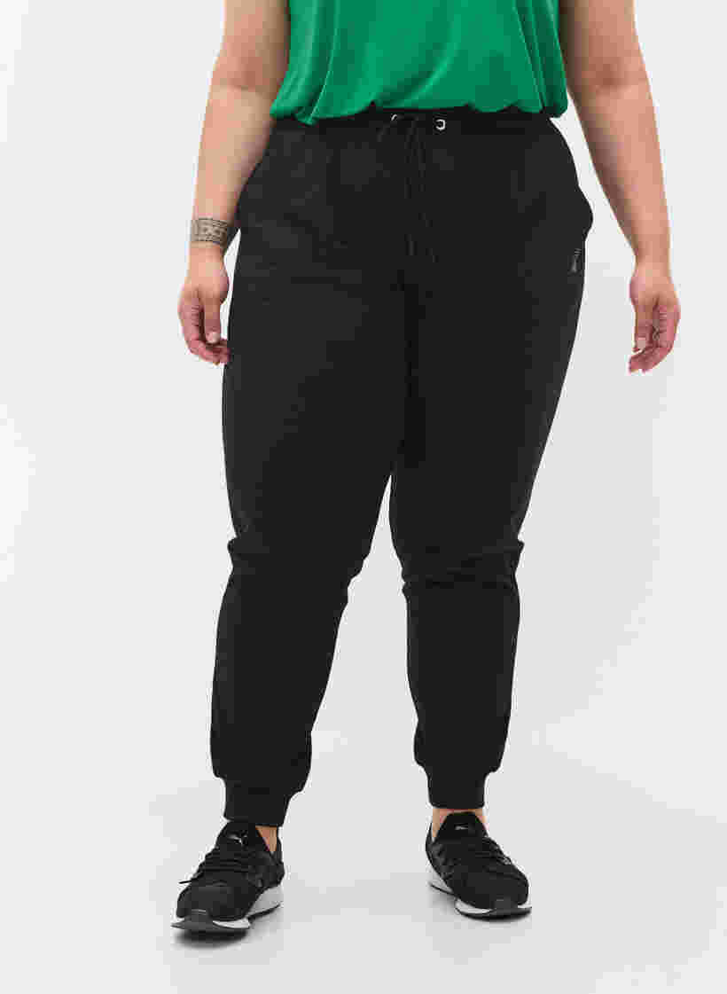 Løse træningsbukser med lommer, Black, Model image number 2