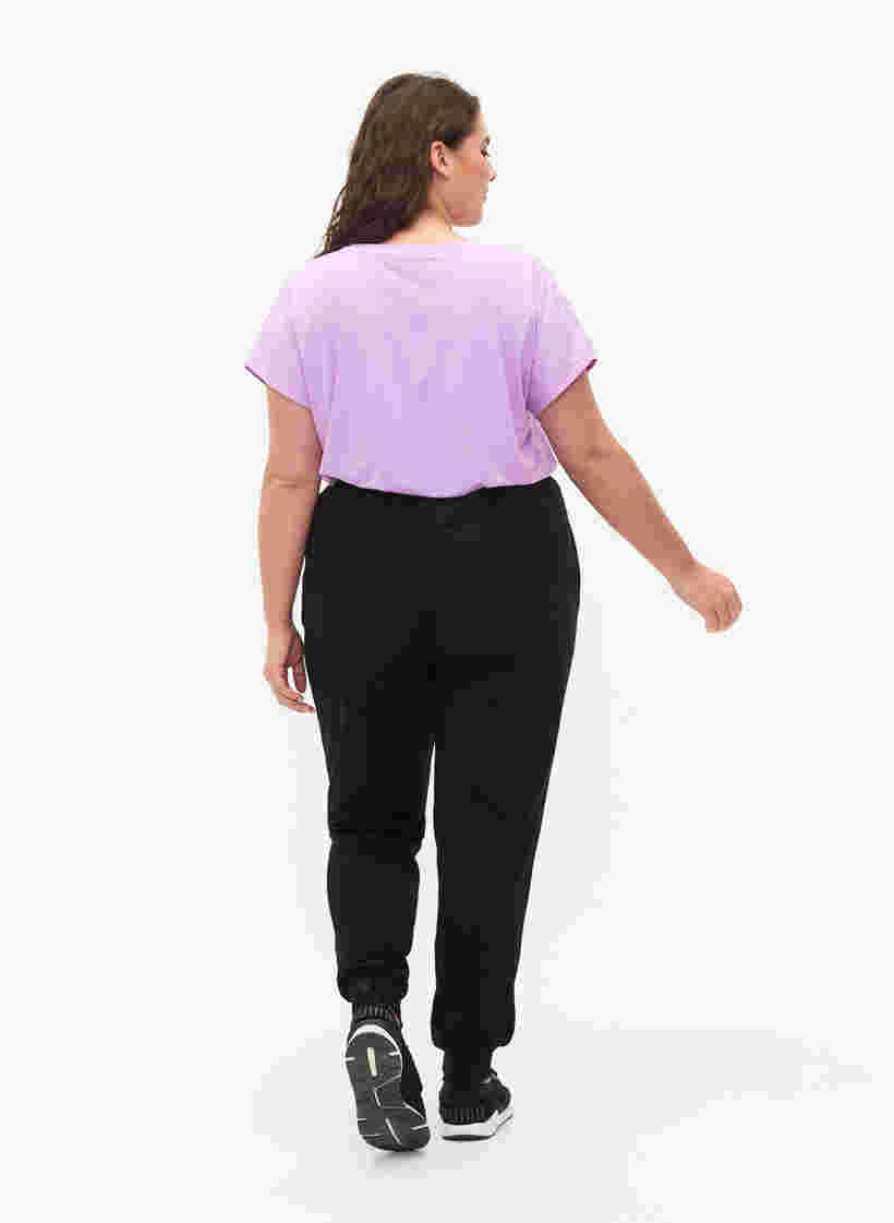 Løse træningsbukser med lommer, Black, Model image number 1