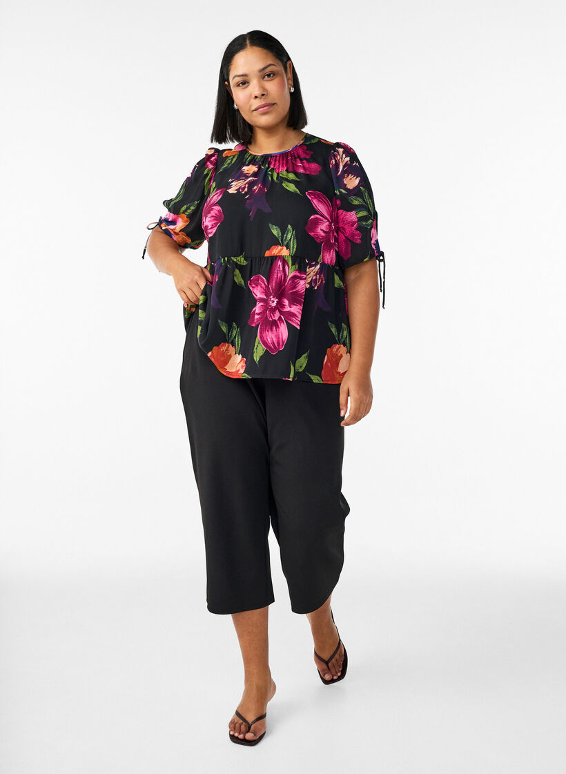 Bluse med blomsterprint og peplum-effekt, Sort, Model image number 1